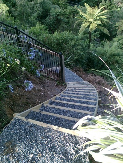 steps by GreenFootprint lead down into the gully