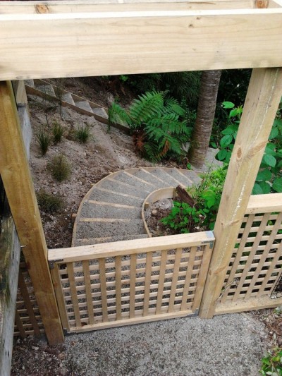 gate leads to steps down into the gully